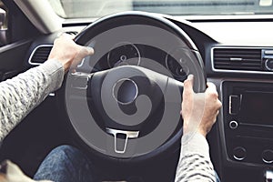 Man holding steering wheel