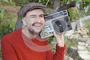 Man holding stereo boombox in the 1980s