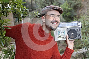 Man holding stereo boombox in the 1980s