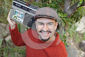 Man holding stereo boombox in the 1980s