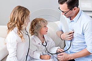 Man holding stethoscope near heart