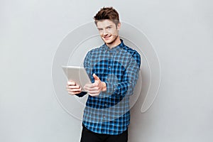 Man holding tablet computer in hands