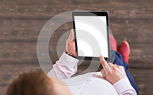 Man holding tablet. Tablet vertical screen mockup. photo