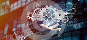 Man holding a technology gear wheel interface3d rendering