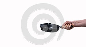 Man holding teflon frying pan on white background