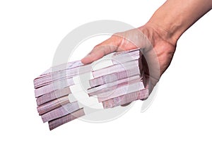 A man holding Thai banknotes on a white background, clipping paths