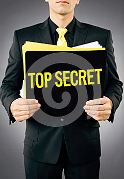 Man Holding Top Secret Folder