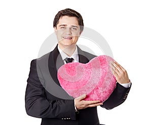 A man holding toy heart