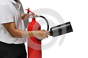 A man holding and training fire extinguisher