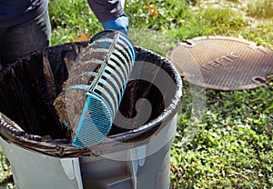 Man holding a Tuf - Tite filter of septic system tank and water wells