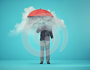 Man holding an umbrella with a cloud inside. Useless and fail concept. Anxiety and mental illness