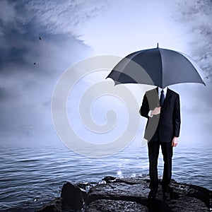 Man Holding Umbrella at the Coast