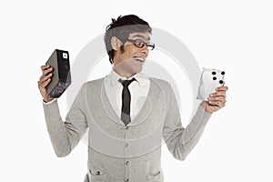 Man holding up an external hard disc