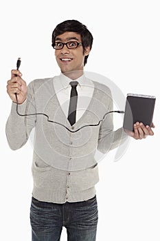 Man holding up an external hard disc