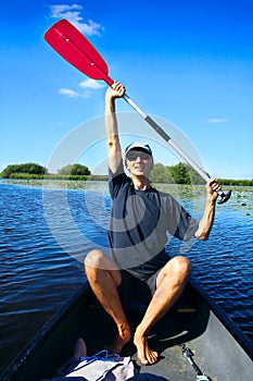 Man holding up his paddle