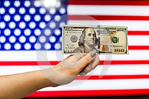 Man holding US Dollar bank note indicating market crash