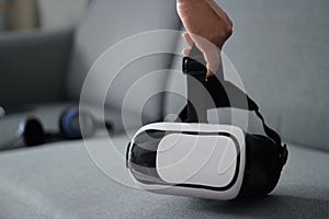 Man holding virtual reality goggles VR headset