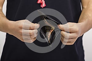 Man holding a wallet with money