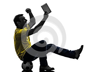 Man holding watching digital tablet silhouette