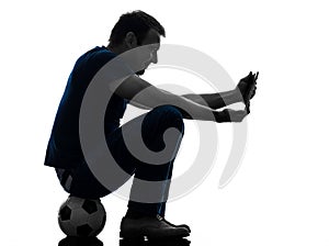 Man holding watching digital tablet silhouette