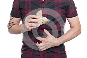 Man holding wheat bread, celiac disease or coeliac condition photo