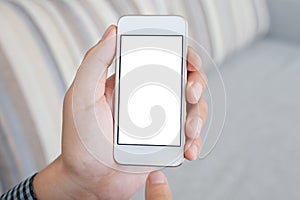 Man holding a white telephone with isolated screen