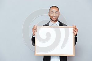 man holding whiteboard