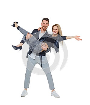 A man is holding a woman in his arms