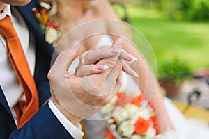 Man holding woman's hand