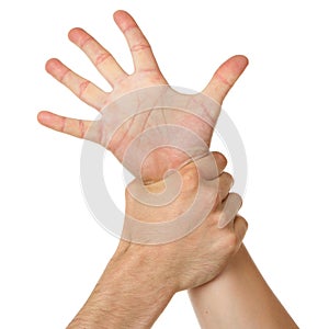 Man holding woman by wrist