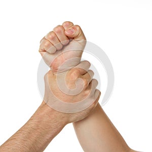 Man holding woman by wrist