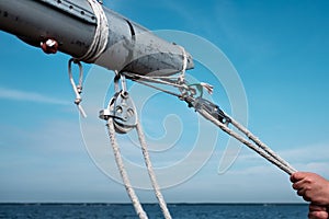 Man holding yacht rope cleat