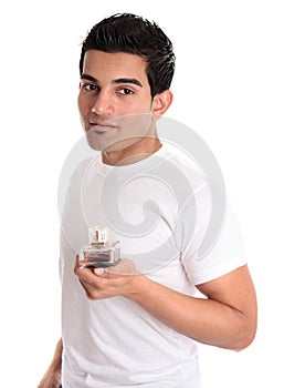 Man holds aftershave or men's fragrance photo