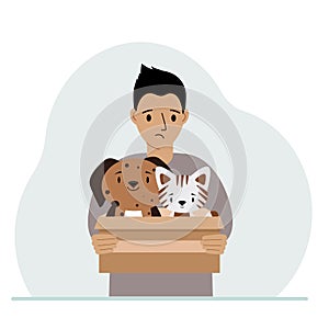 A man holds a cardboard box with a cat and a dog. The concept of rescue, help and care for pets.