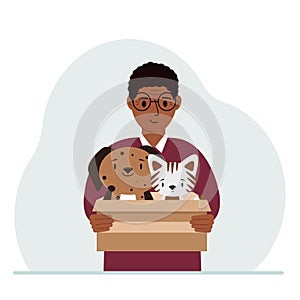 A man holds a cardboard box with a cat and a dog. The concept of rescue, help and care for pets.