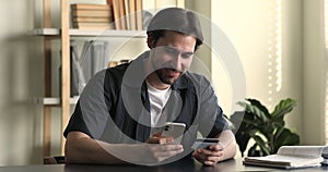 Man holds cellphone and credit card enjoy online mobile shopping