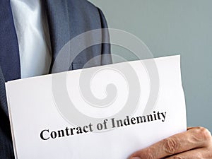 A man holds Contract of indemnity papers.