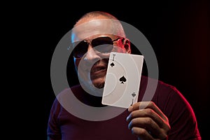 A man holds a deck of play cards