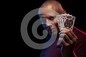 A man holds a deck of play cards