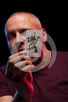 A man holds a deck of play cards