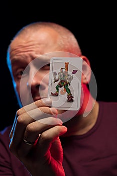 A man holds a deck of play cards