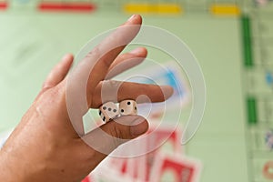 Man holds the dice. Hand with dice