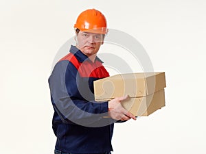 Man holds in his hands a big box on a white background