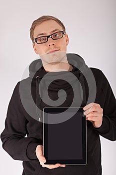 A man holds his tablet computer in the camera