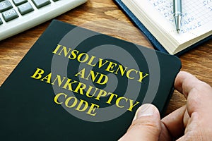 Man holds Insolvency and bankruptcy code IBC photo