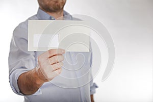 Man holds a letter into the camera