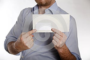 Man holds a letter into the camera