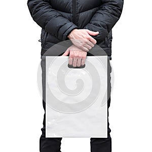 A man holds a mockup white plastic bag. A man with a package on isolated background