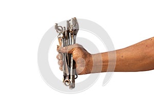 A man holds old and rusty tools for mechanic work