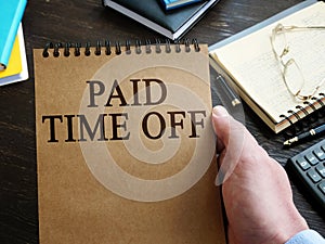 Man holds Paid Time Off PTO policy